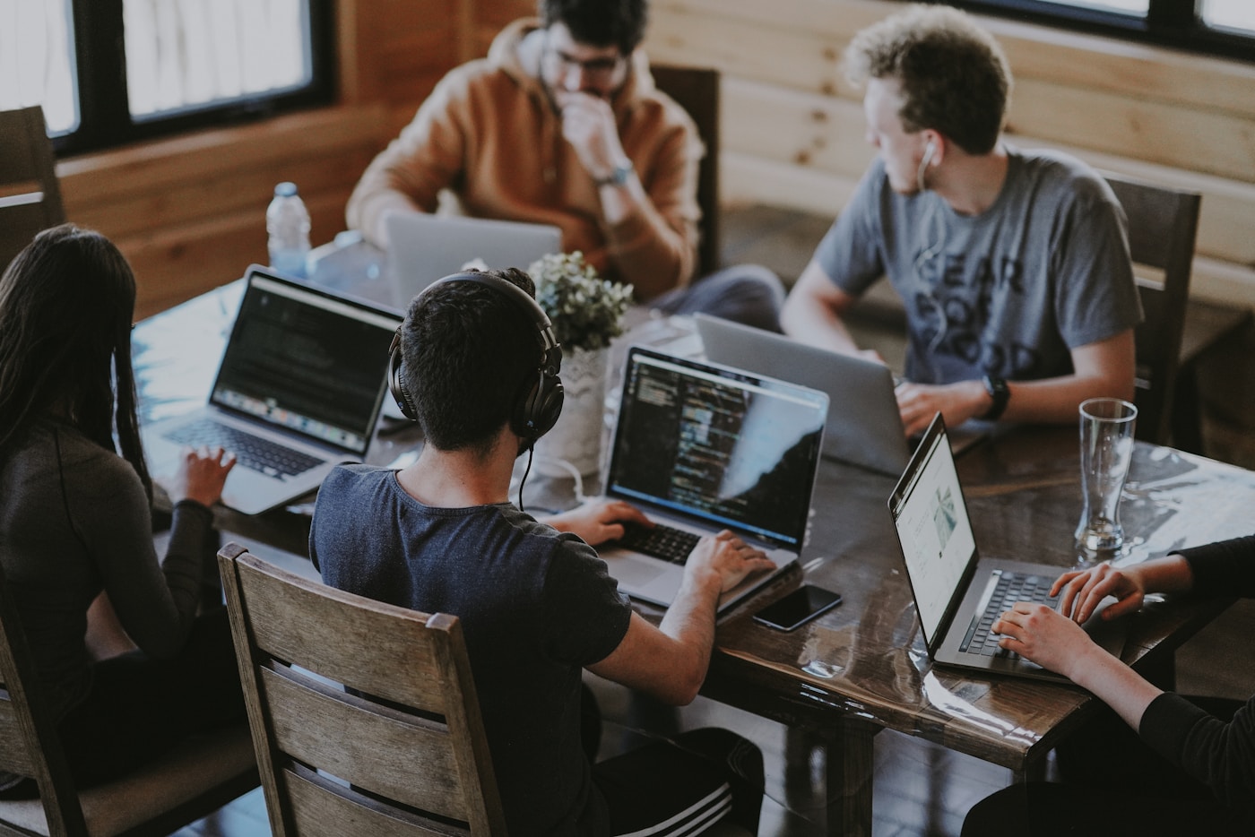 Team discussing work together at a meeting table